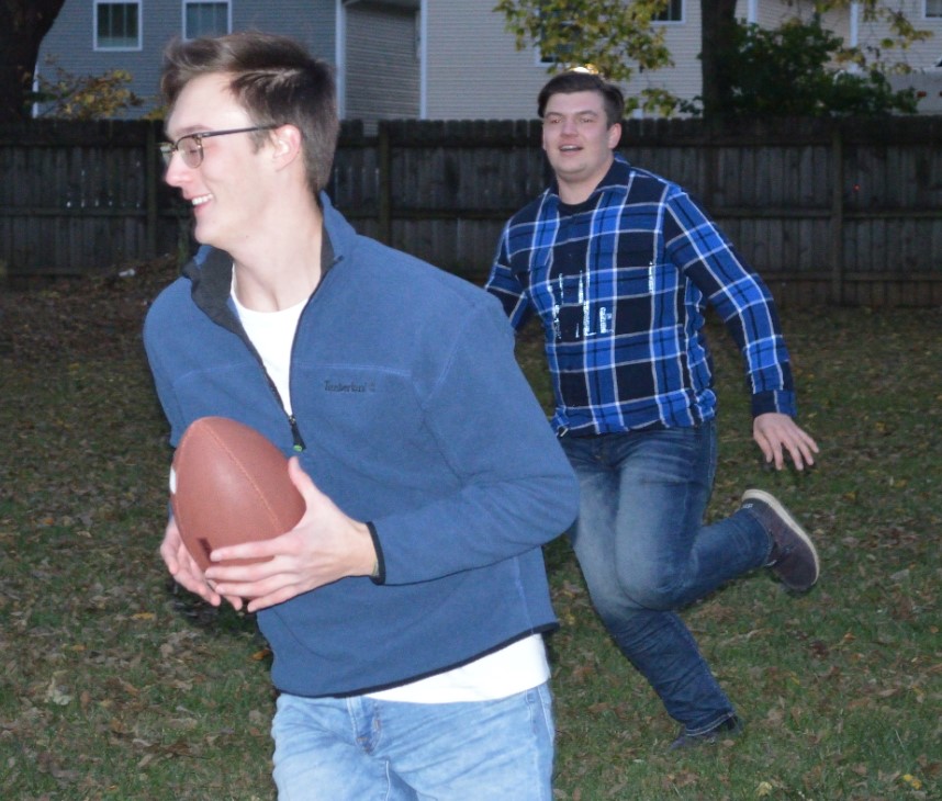 man plays basketball